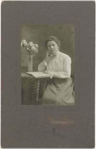 Studio portrait of a seated woman