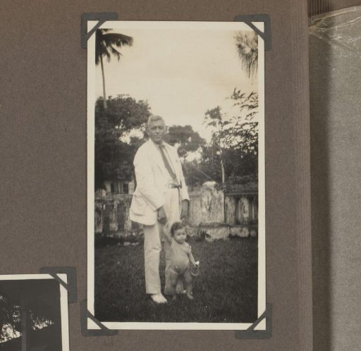 Man with a child in a garden
