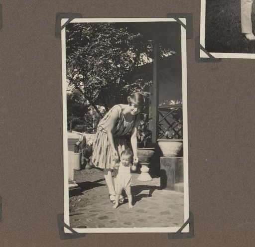 Woman with a child in a garden