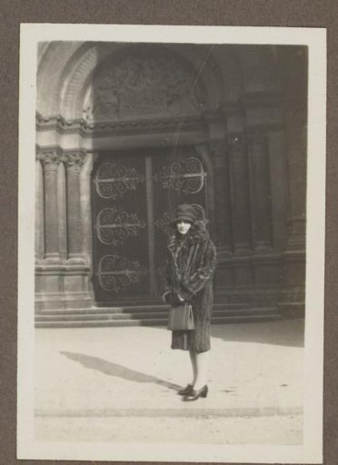 Henriëtte Wassink in a fur coat before a church portal