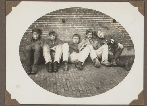 Five men in uniform seated against a wall, with Johannes van Zijll de Jong second from the right