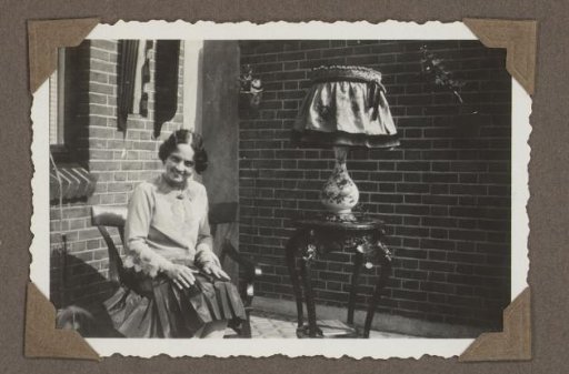 Henriëtte Wassink seated on a balcony or in a garden