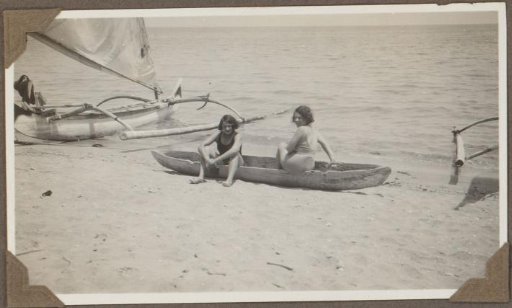 Two women in a prauw at the beach