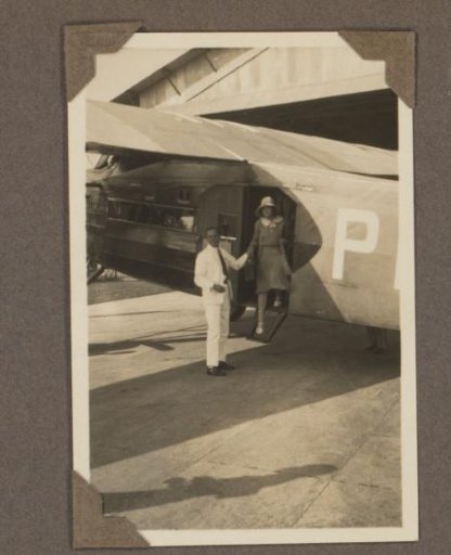 Woman stepping out of an aircraft at Andir airfield in Bandung