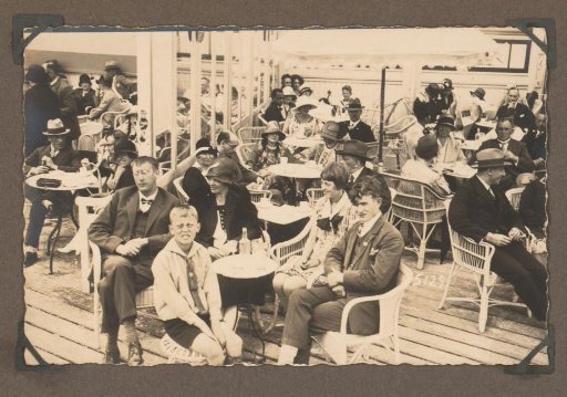 People sitting at tables on the terrace on the pier in Scheveningen