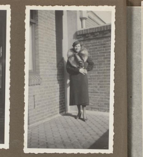 Wilhelmina van Zijll de Jong in a Long Coat by a House