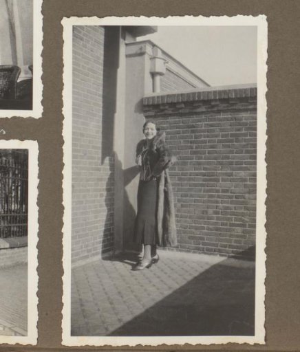 Wilhelmina van Zijll de Jong in a Long Coat by a House