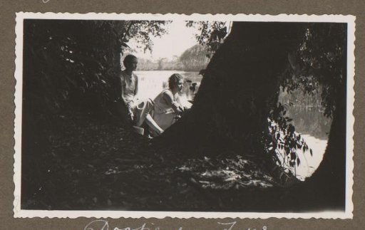 Dootje van Zijll de Jong and a woman sitting under trees, near Bandoeng