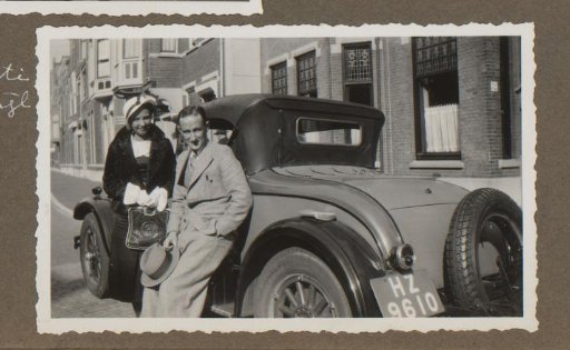 Man and woman by a car