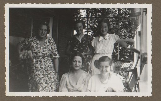 Group portrait of Wilhelmina van Zijll de Jong with four other women on a veranda