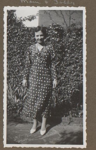 Portrait of a Woman Standing in a Garden