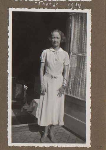 Portrait of a Woman Standing in a Doorway