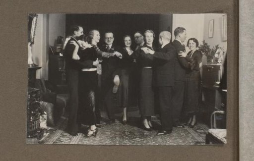 Company dancing in a living room