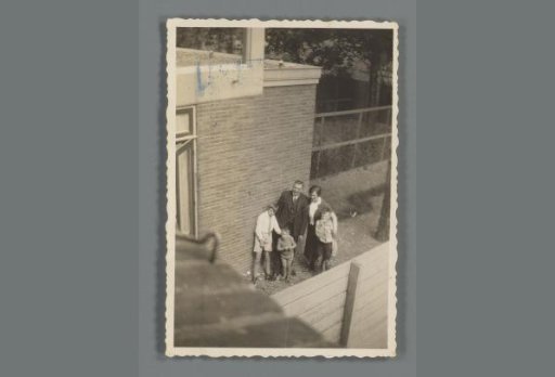 Family standing in a garden, seen from above