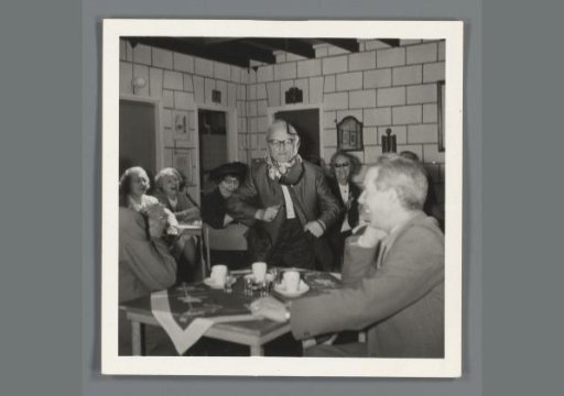 Dancing older woman with smiling onlookers