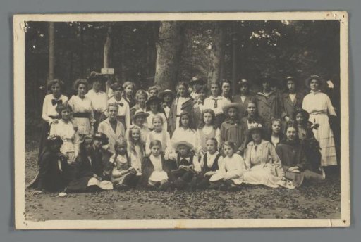 Group portrait of unknown girls in a forest