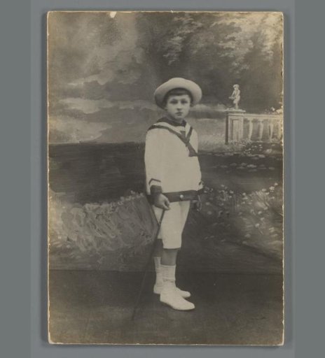 Portrait of an Unknown Boy in a Photography Studio