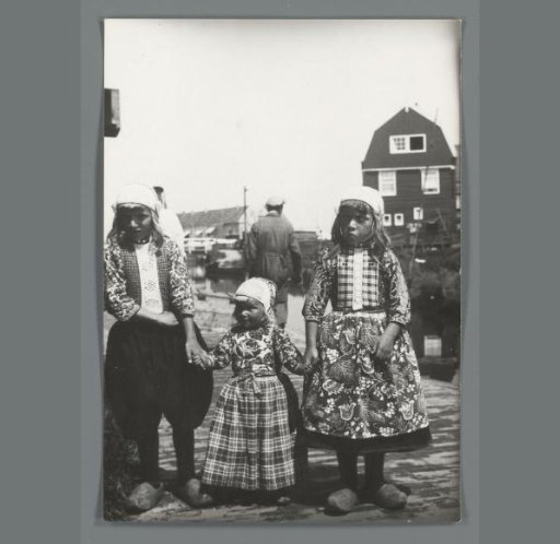 Group portrait of two unknown Marker boys and a girl, in costume
