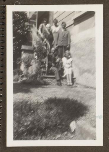 Group portrait of a family on the stairs of Villa Mari