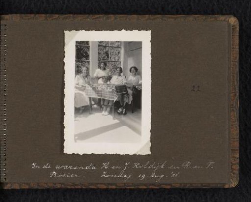 Group portrait of four women on a veranda