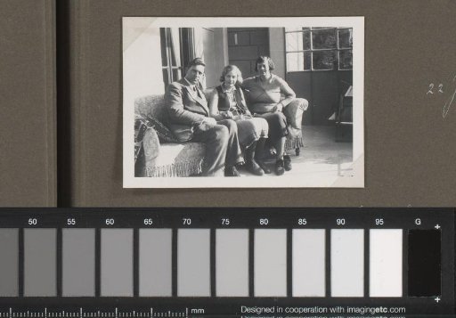 Portrait of three people, designated as the Streekstra family, on a bench