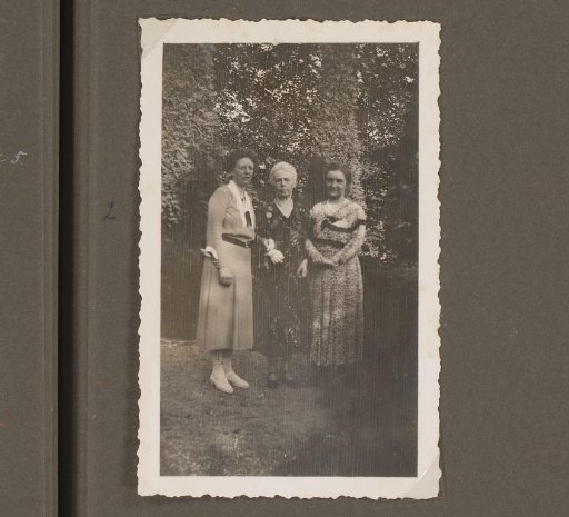 Three Women Standing in a Garden