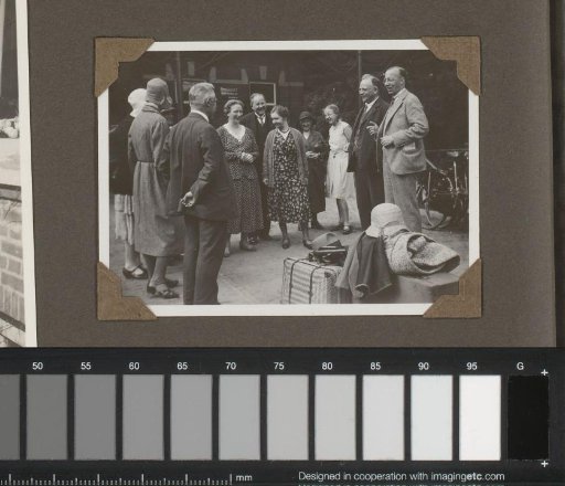 Group of Travelers with Luggage at a Station