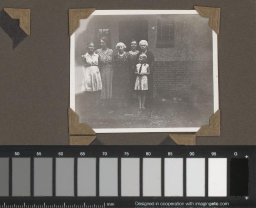 Family portrait in front of a house