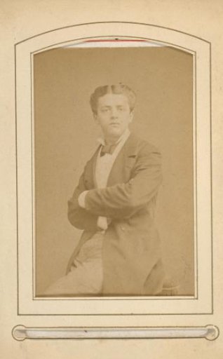 Portrait of a young man with his arms folded