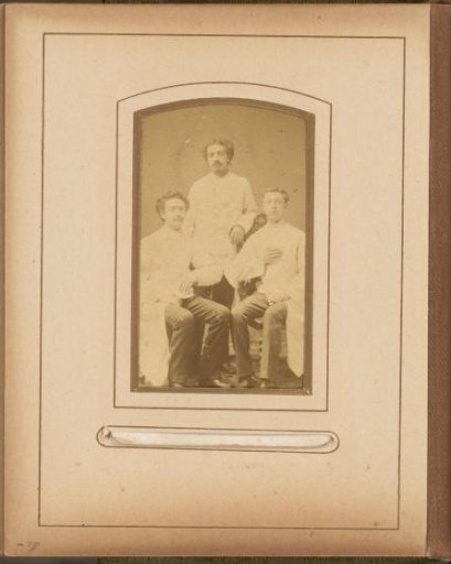 Portrait of three young men in white clothing