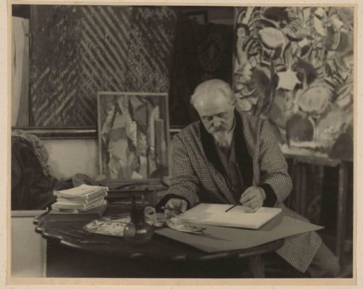 Portrait of an artist sketching in a painting studio