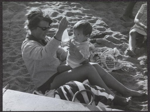 Mother with child on the beach