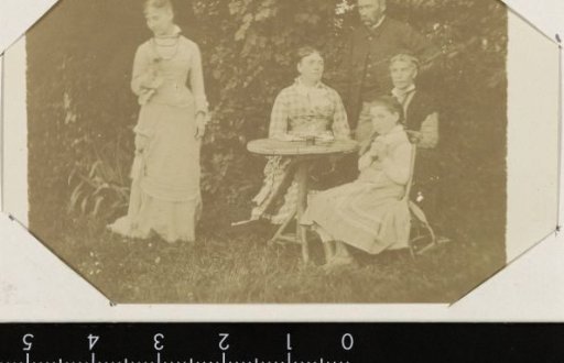 Portrait of an unknown family in a garden