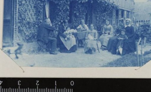 Group portrait of an unknown group in front of a house