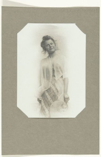 Portrait of an unknown woman with a hat in her hand