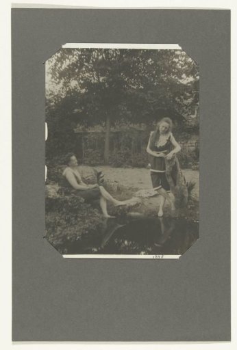 Portrait of an unknown woman and a girl in bathing costume by a pond