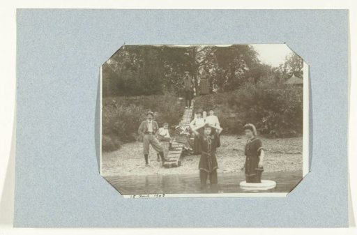 Group portrait of unknown bathers on and in the water