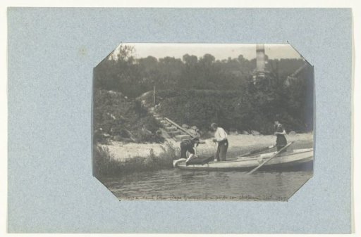 Three people in a rowing boat