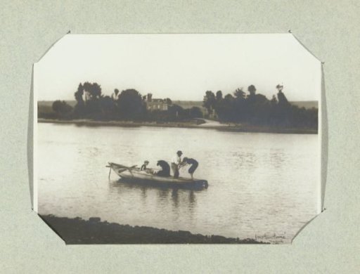 Family in a rowing boat on a river