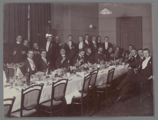 Portrait of a group of young men at table