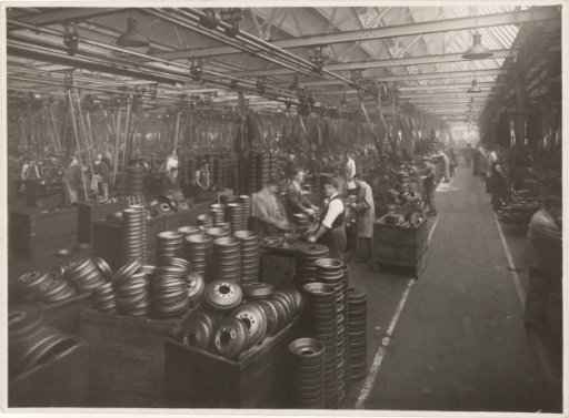 Employees of the Wolseley Motor Company among Wheel Caps in the Ward End Works, the Factory in Birmingham