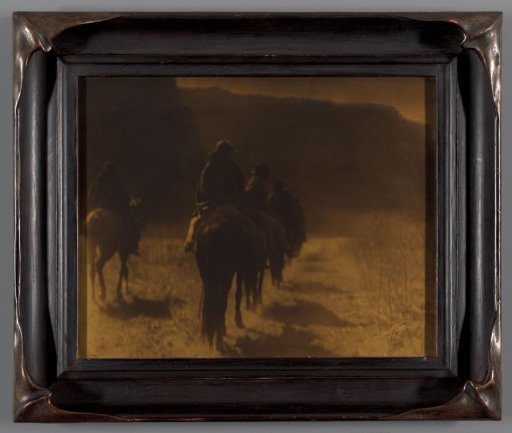 Group of Navajo riders, seen from behind