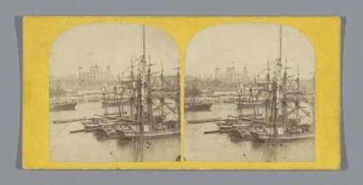 View of the Tower of London, across the Thames with boats