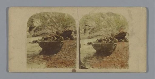 Boats with stones on a beach