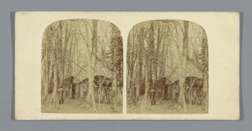 Man in front of a hut in Whiteknights Park, Reading