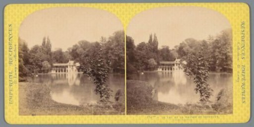 View of the lake and a house in Le Hameau de la Reine near the Petit Trianon