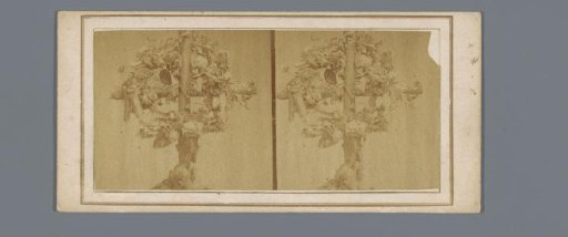 Branch in the shape of a cross with decorations