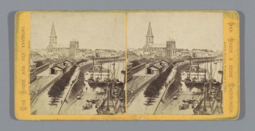 View of a quay in Cologne with the St. Kunibert Church in the background