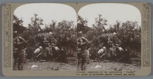 Gunners, suspicious of an approaching "Taube", don masks as protection against German gas shells