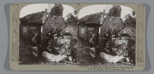 R.A.M.C. at Monchy dressing station attending to wounded coming down from the line